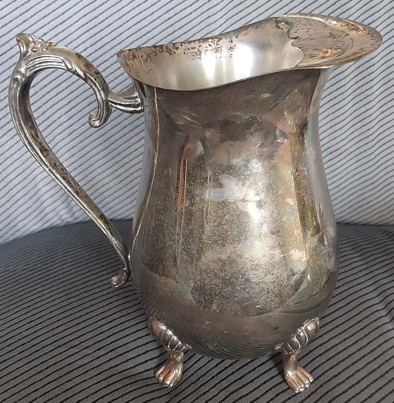 A sturdy Silver plated water jug