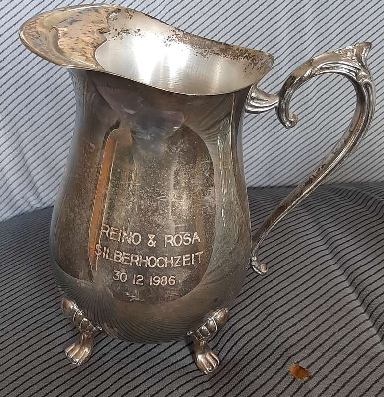 A sturdy Silver plated water jug