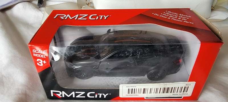 Black BMW M4 Limited Edition Die-Cast Metal Model Car, with functioning opening doors!