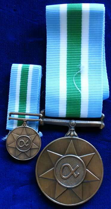 ## Unity Medal to O/Kpl JA Herbst with Miniature Medal ##