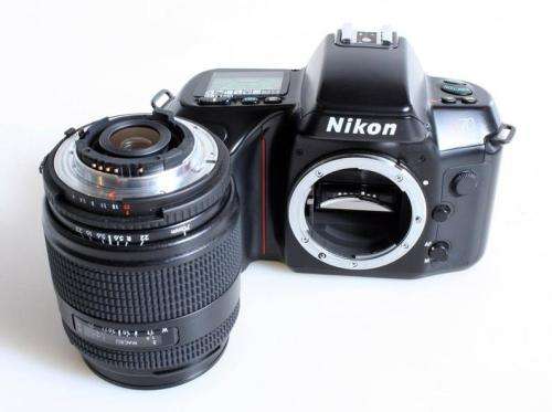 Nikon N70 Film Camera with 70-210mm f4~5.6 Lens//Student Photography. Battery cover is sellotaped