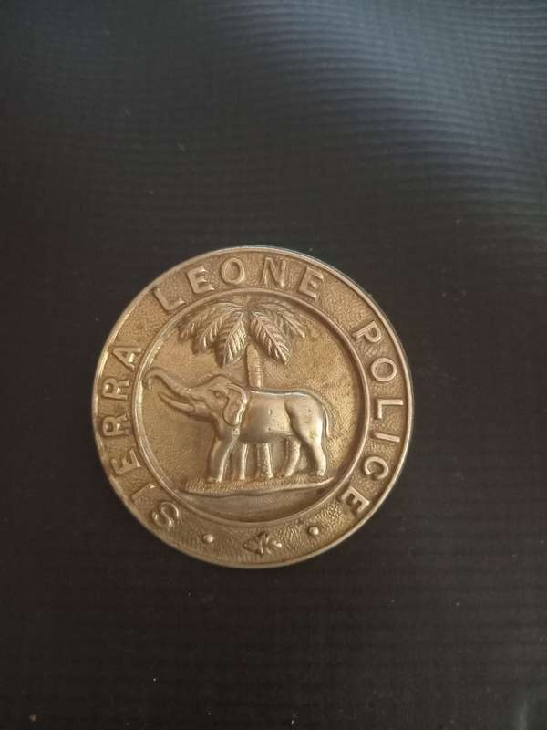 Sierra Leone Police cap badge. See description