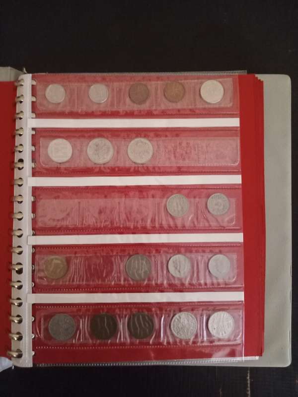 14 Page album filled with over 100 World  coins