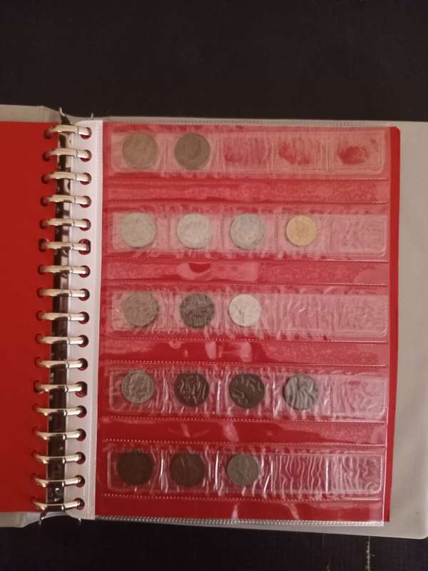 14 Page album filled with over 100 World  coins