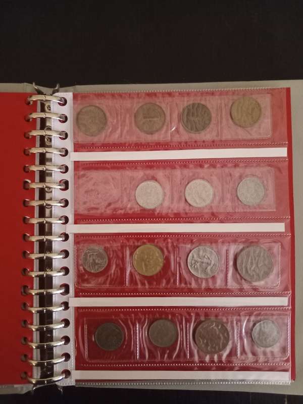 14 Page album filled with over 100 World  coins