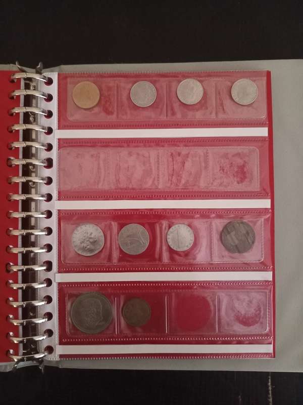 14 Page album filled with over 100 World  coins