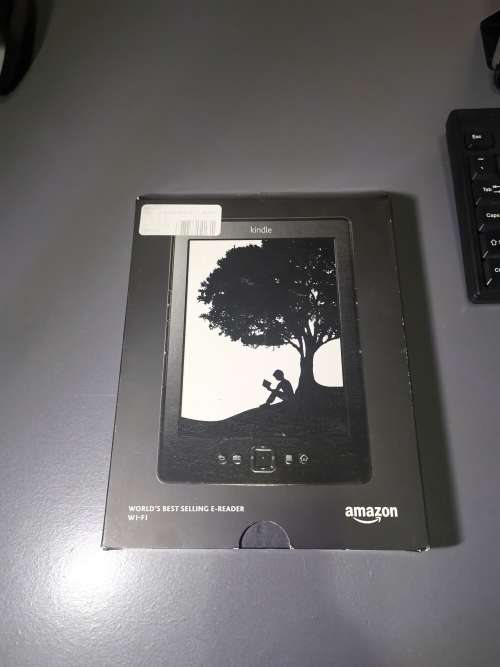 Kindle WiFi e ink. With a free Speck cover.