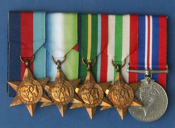 Framed group of five WWII medals JX234871 Leading Seaman W Devlin Royal Navy EF