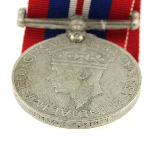 War Medal 1939 - 1945 awarded to a South African named WWII F