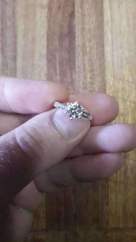 18ct White Gold Solitaire with Channel: Total Diamond weight 1.12ct with 1ct Center stone