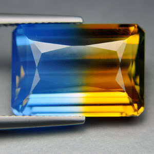 14.15 ct GOLD  & BLUE EMERALD CUT QUARTZ GEMSTONE