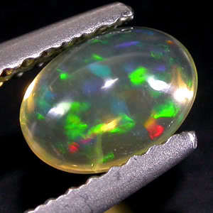 UNHEATED 0.55 ct RARE MULTI COLOUR PLAY EFFECT OPAL OVAL GEMSTONE