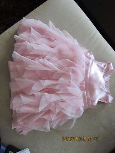 Beautiful baby girls dress by UK Designer Early days. SIze 6-9 months