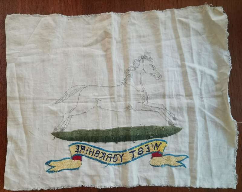 Large WW2-era West Yorkshire Regiment hand-embroidered insignia on cloth