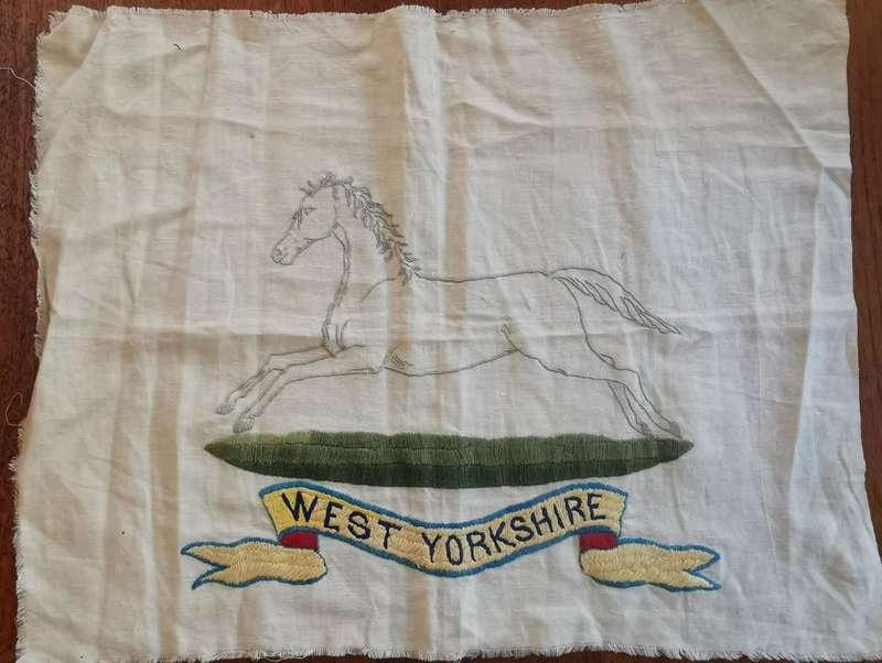 Large WW2-era West Yorkshire Regiment hand-embroidered insignia on cloth