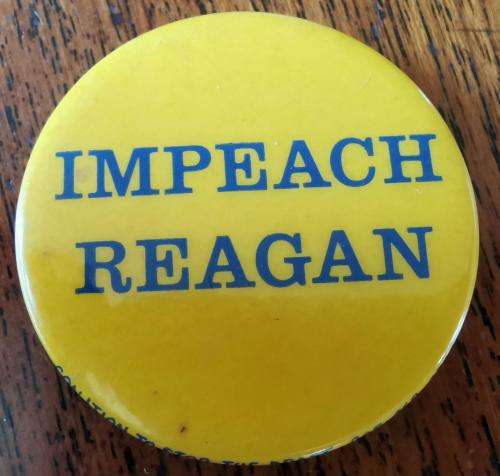 Vintage `Impeach Reagan` pin badge circa 1980