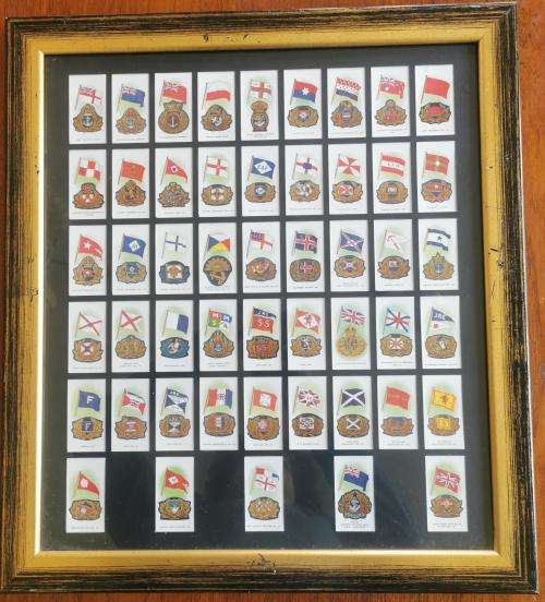 Full set of 50 John Player Cigarette Cards Ships` Flags and Cap Badges 1997 reprint - framed