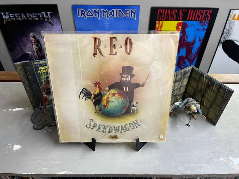 REO Speedwagon -The Earth, A Small Man, His Dog and a Chicken vinyl record (VG+)
