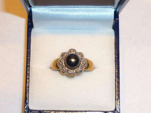**R5600**RSOLID GOLD 9CT BLACK PEARL AND CZ RING