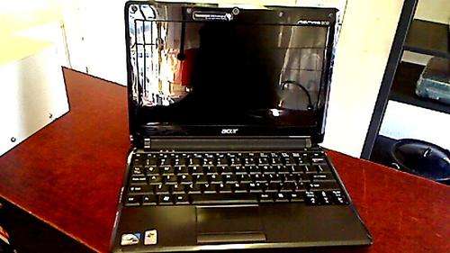 Acer Aspire One Net Book + Charger. Netbook works only with the charger plugged in !!!!!