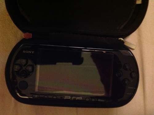 Sony PSP 3004 console with Carry case and earphones.2GB memory card provided.Like Brand new