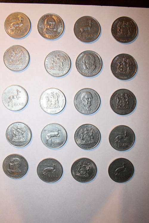 Twenty old R1.00 coins of various dates.