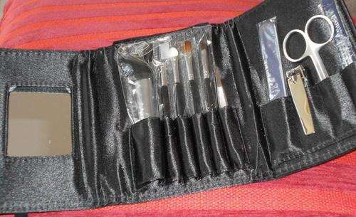 Avon make-up brush set and manicure set in black satin purse
