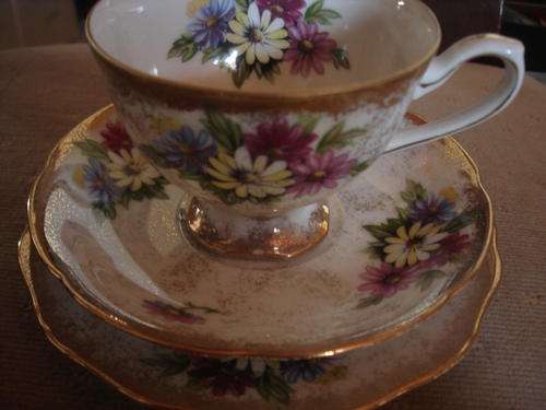 PRETTY FLORAL AND GILDED PORCELAIN TEA TRIO