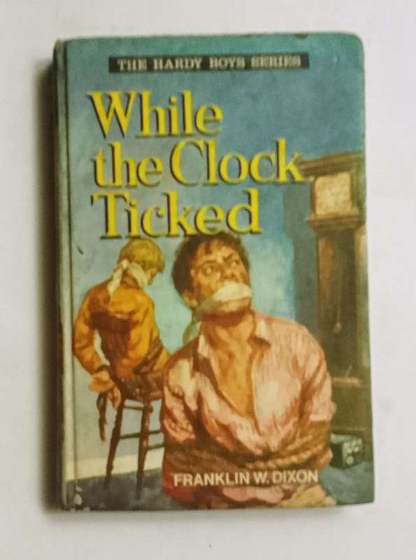 The hardy boys series: While the clock ticked- By: Franklin W. Dixon