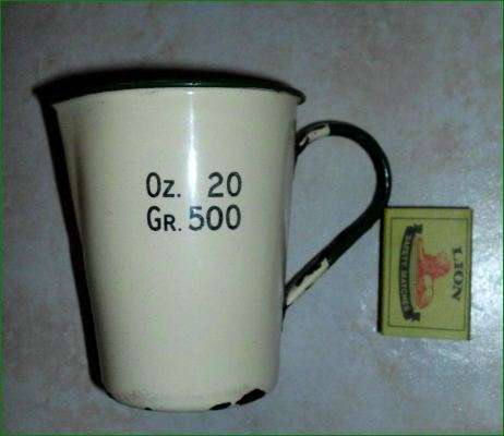 Old enamel measuring jug