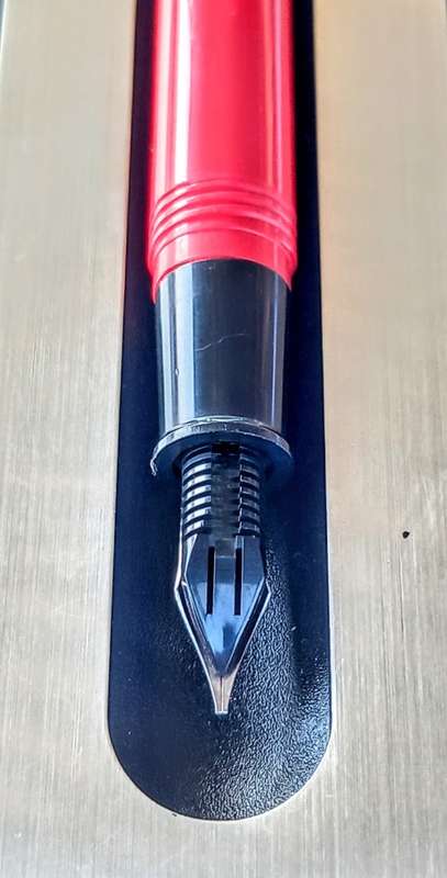 Red and Silver Sheaffer Fountain Pen with 2 extra Nibs and 5 Refills