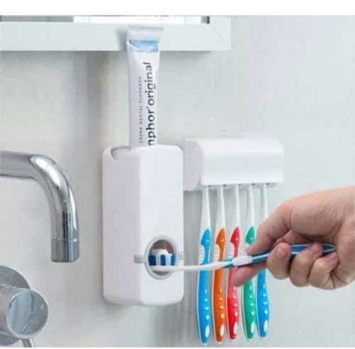 Toothpaste dispensers with toothbrush holder