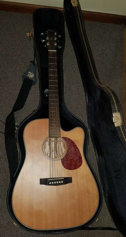 Cort Acoustic steel string Guitar with tuner/pickup and hard carry case