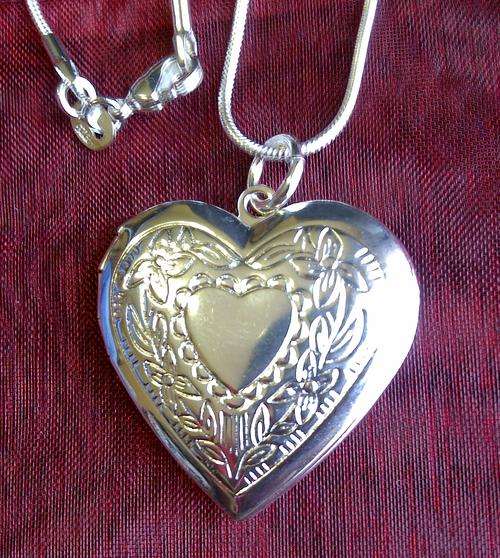 ONLY 2 AVAILABLE**SILVER FILLED HEART SHAPE LOCKET PENDANT AND CHAIN**DONT MISS OUT ON THIS ONE**