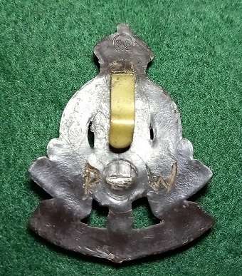 WW2 Royal Army Ordnance Corps Plastic Economy Cap Badge - only one lug