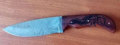 Stunning Damascus steel knife with carved wolf motive handle and leather sheath