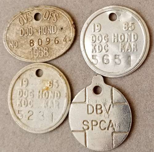 Lot of 4 vintage dog licence tags