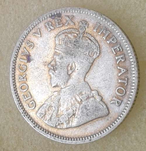 Scarcer 1928 union silver shilling.