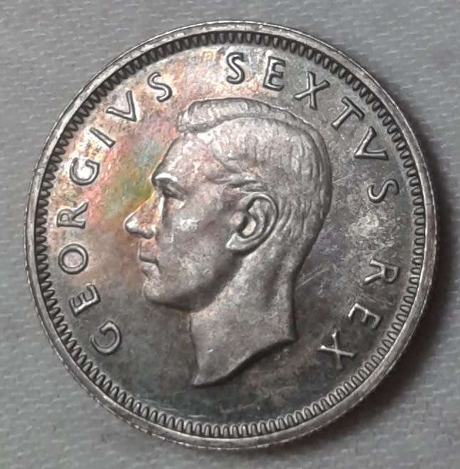Nice 1952 union proof silver sixpence with iridescent toning
