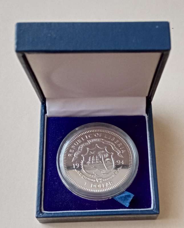 Encapsulated 1994 Liberia uncirculated 1 dollar in case (Nelson Mandela)