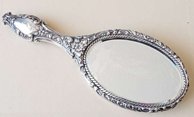 1902 Victorian hallmarked silver handheld mirror with floral design