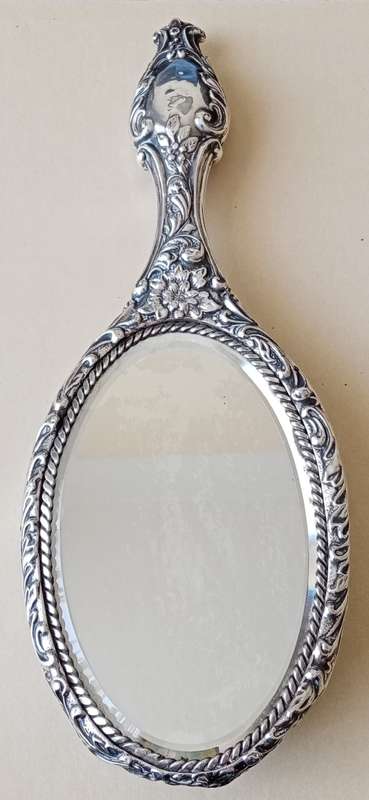 1902 Victorian hallmarked silver handheld mirror with floral design