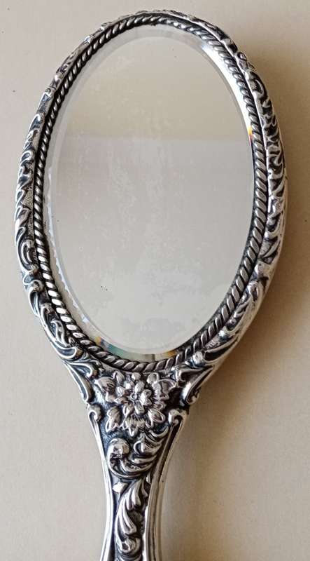 1902 Victorian hallmarked silver handheld mirror with floral design