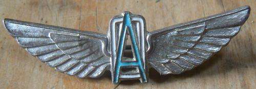 Vintage enamelled metal badge of private charter company Owen Air / Owenair