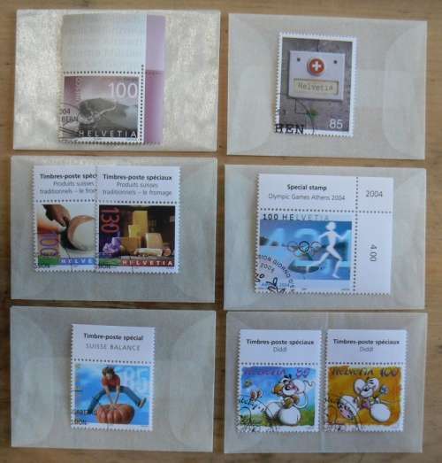 Switzerland 2004 lot of 31 officially cancelled stamps + blocks & sheets + 24 FDCs + 7 cards