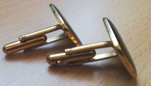 Pair of vintage Santam cufflinks - black with gold umbrella
