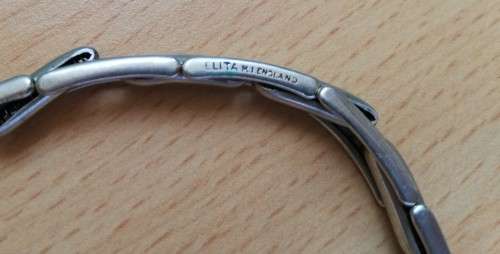 Two metal bracelets with elastic inner, stamped