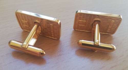 Pair of vintage gold-plated cufflinks with WR logo