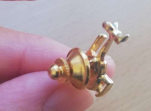 Pair of vintage gold-plated helicopter pin badges