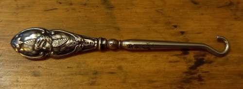 Silver handled boot hook with stunning cherub design, 1903